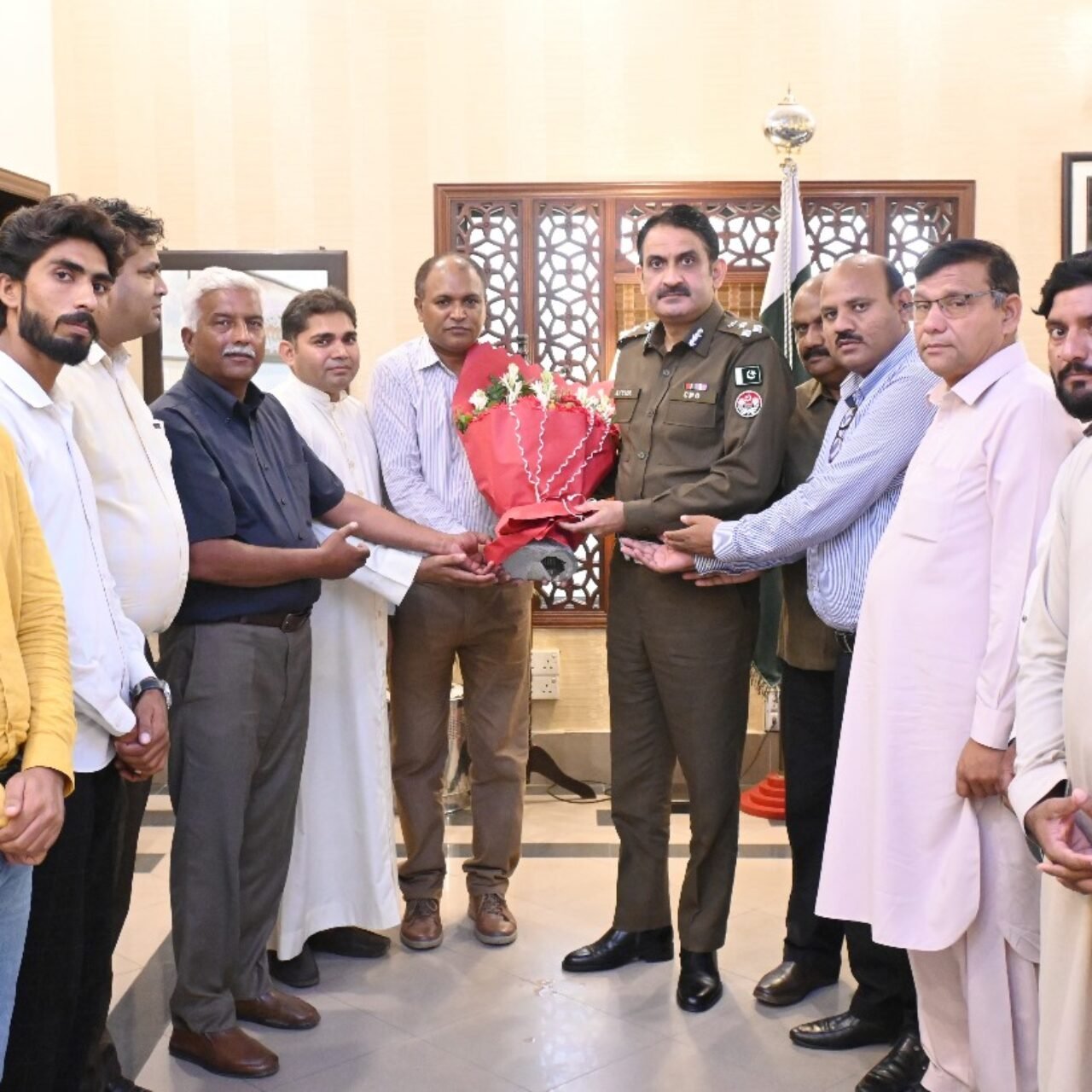 I along with A member of the District Peace Committee, and religious leadership Congratulated, presented flowers to a city police officer Muhammad Ayyaz Saleem for getting a promotion to Deputy Inspector  General of Police.