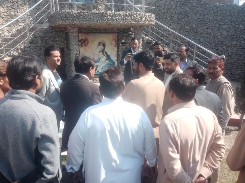 Rev. Fr. Shakeel explaining Mr. Sultan the design and structure