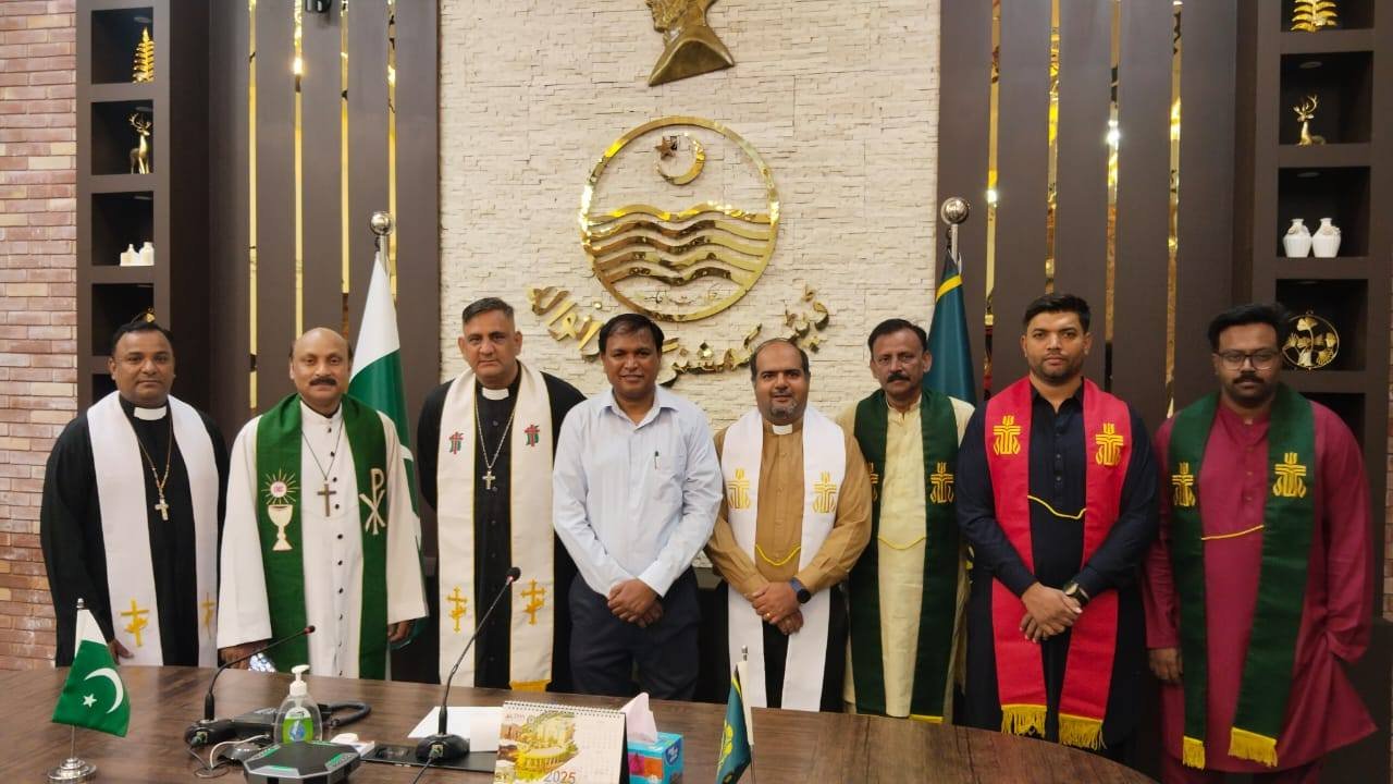 A group photo with the pastors at the office of the DC Gujranwala.