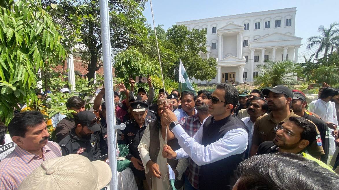 Hoisting of the national flag at the Youm-e-Takbeer ceremony