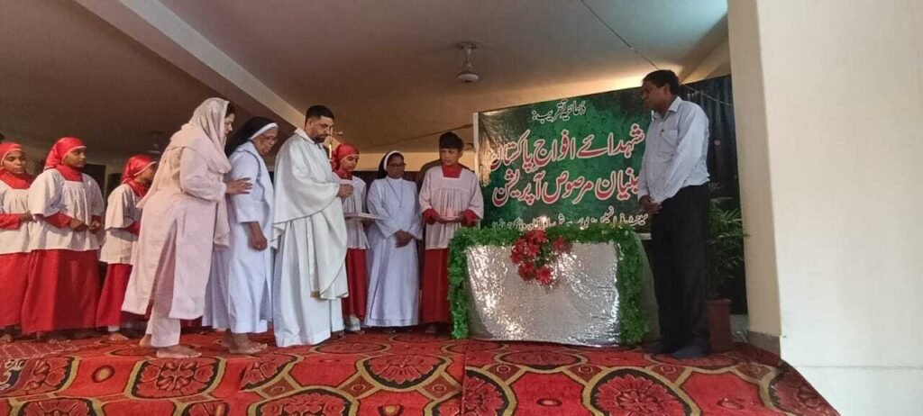 Parish priest, Sisters, and others. lit the candles in memory of the Martyrs.