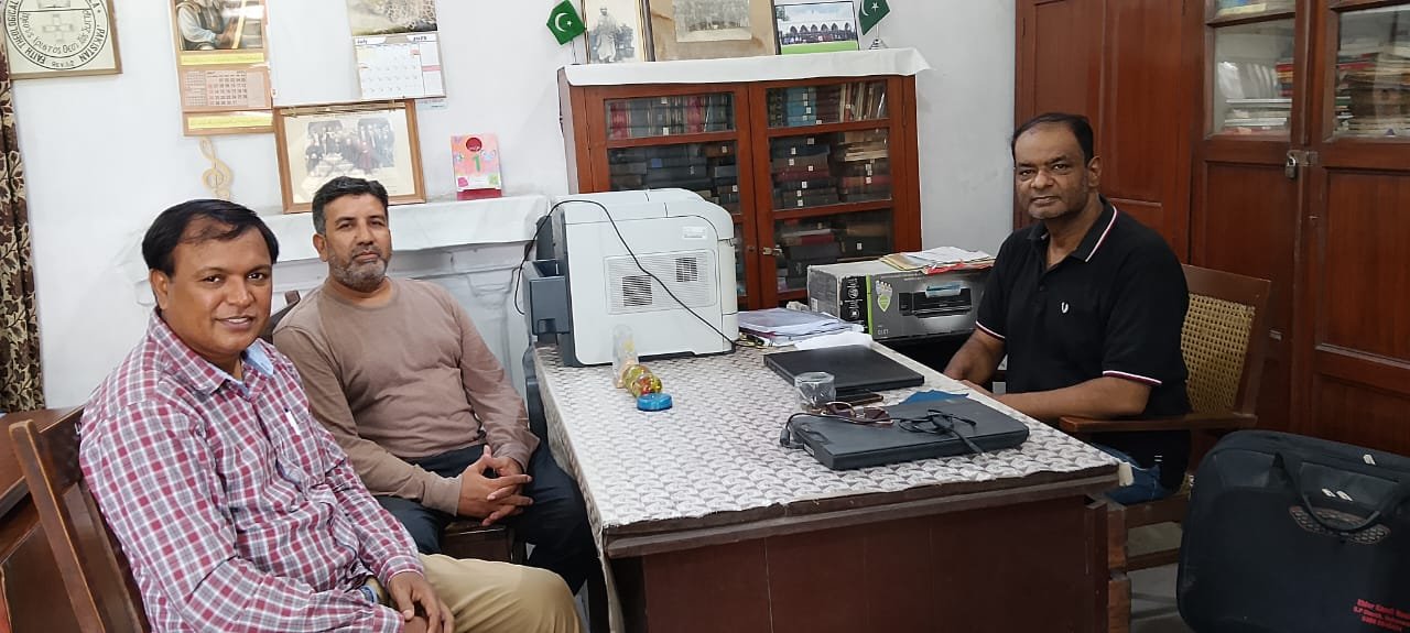 Mr. Shahzad Lawrence, Elder Kamil Nasir, and Rev. Inam N. A. Khan during a meeting.