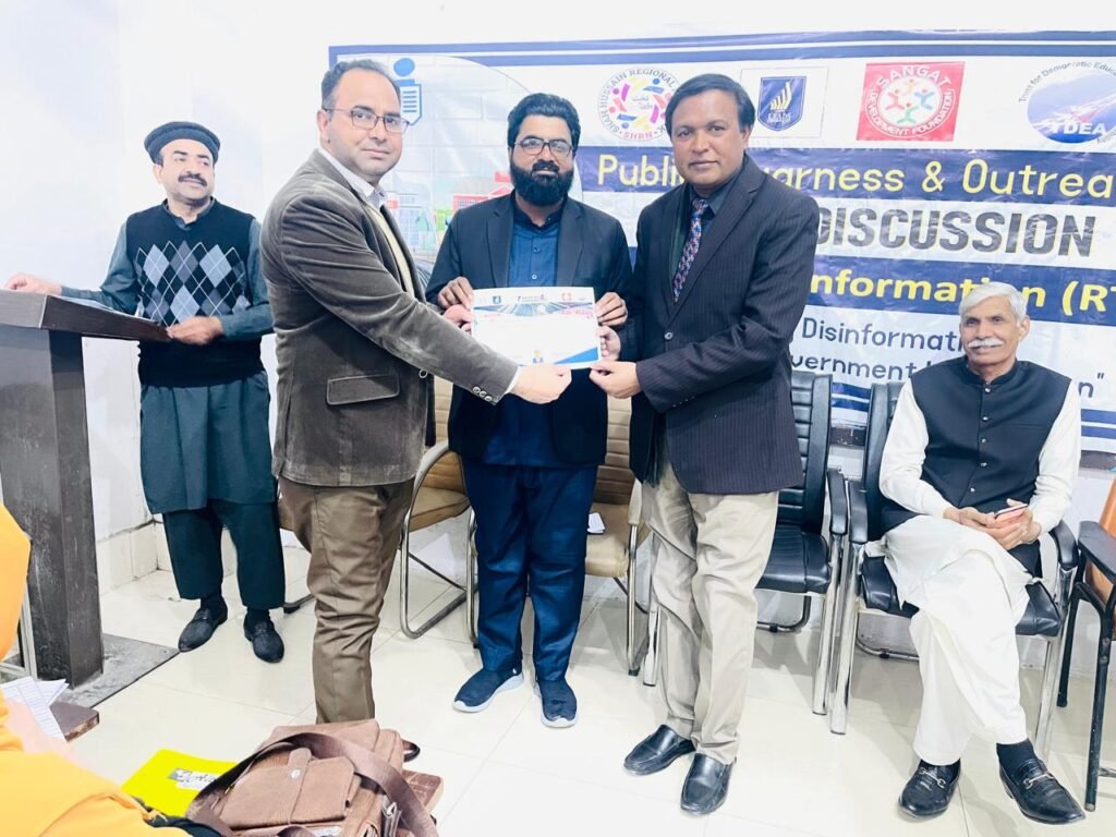 Presenting an appreciation certificate to Shahzad Lawrence