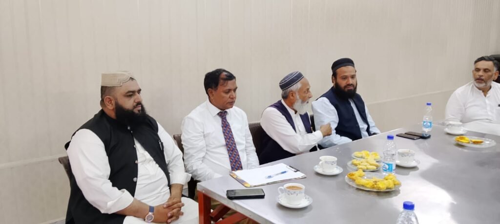 Haji Babar sharing his views during a meeting