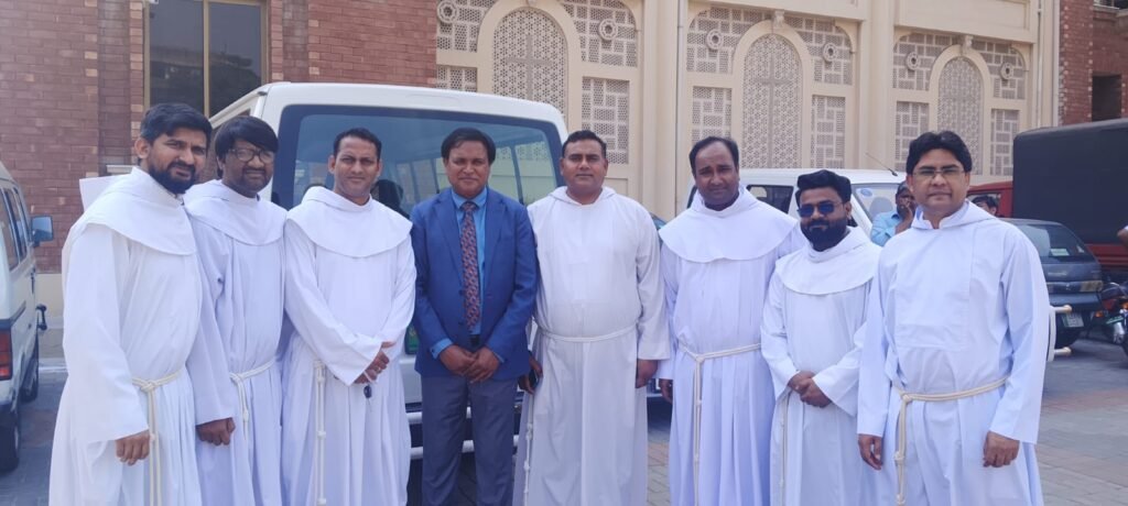 A picture with Rev. Fr. Afzal Iqbal and other priests at Archdiocese of Lahore