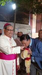 kissing the episcopal ring of the Catholic Archbishop