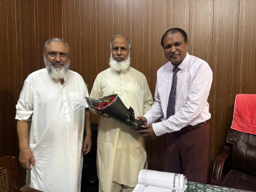Presenting flowers to worthy Dr. Prof. Muhammad Akram Virik
